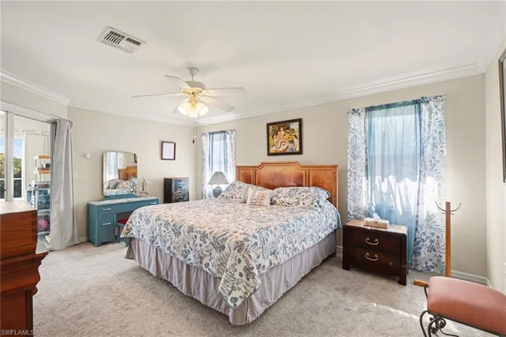 Primary bedroom with sliding doors to pool