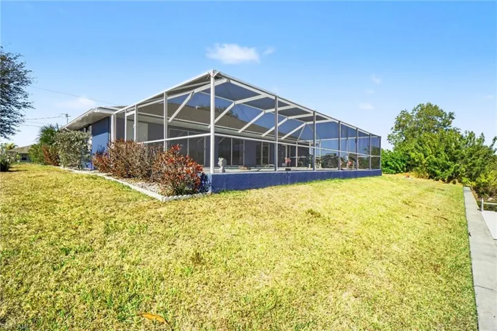 Large lanai with lots of room for patio furniture and lounge chairs to entertain large groups