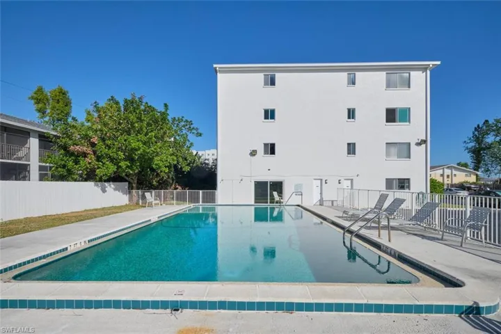 View of pool with a patio area.
