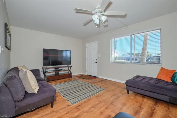 Living room with beautiful wood-style flooring