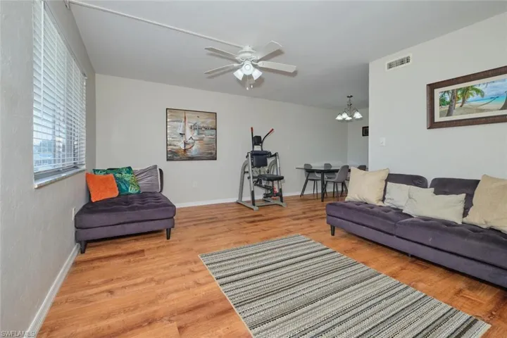 Living room with beautiful wood-style floors throughout.