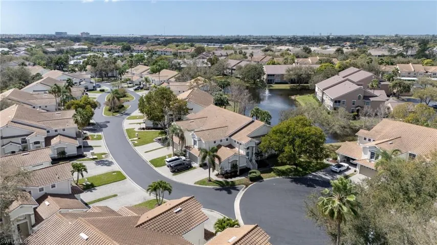 Aerial perspective of suburban area with a large body of water