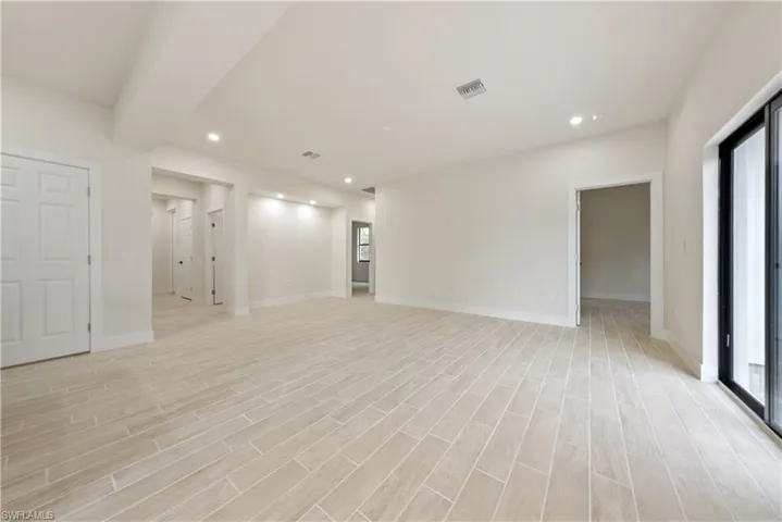 Unfurnished room with recessed lighting and light wood finished floors