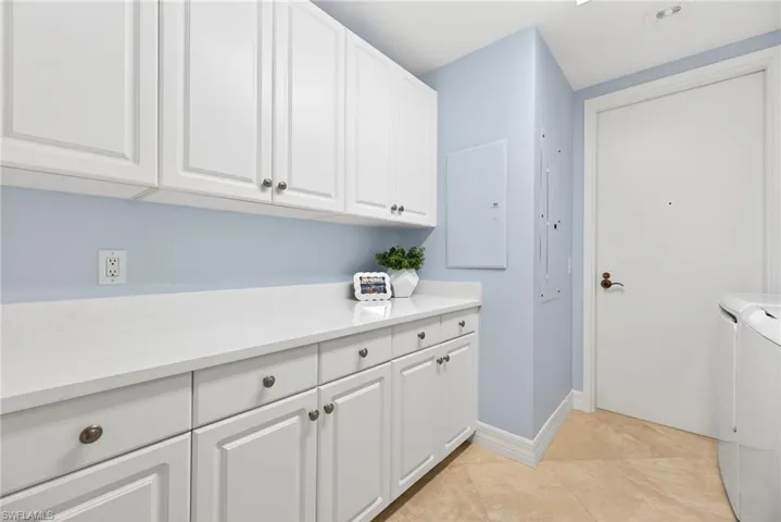 Lots of Cabinetry & Storage in the Laundry Room
