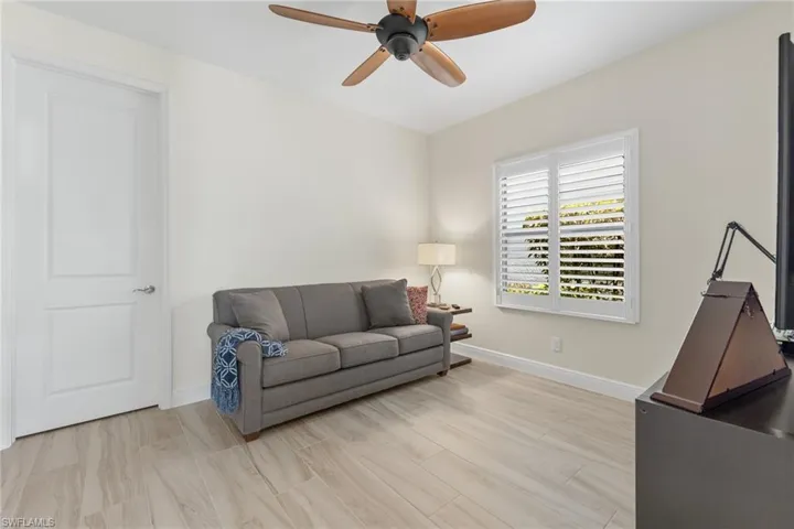 Living room featuring light hardwood / wood-style flooring and ceiling fan