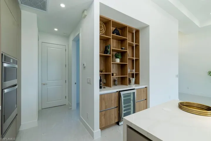 Bar with double oven and beverage cooler