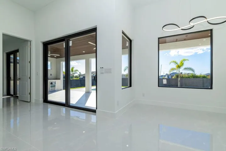 Empty room featuring plenty of natural light