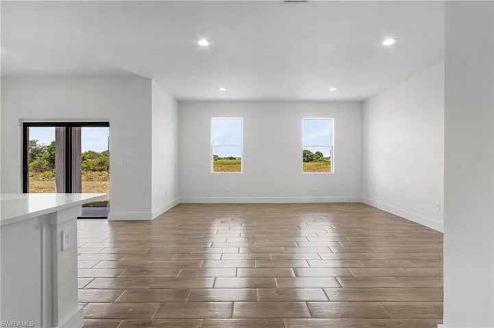 Empty room featuring hardwood / wood-style floors