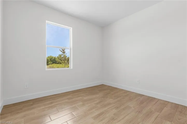 Spare room featuring light hardwood / wood-style flooring