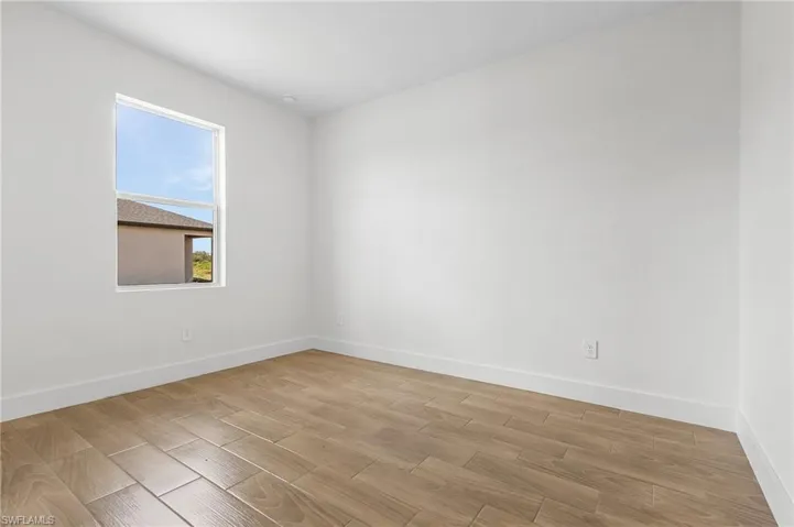 Spare room with light wood-type flooring