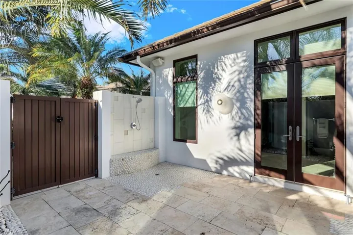 Private outdoor shower that also connects to lanai and pool.