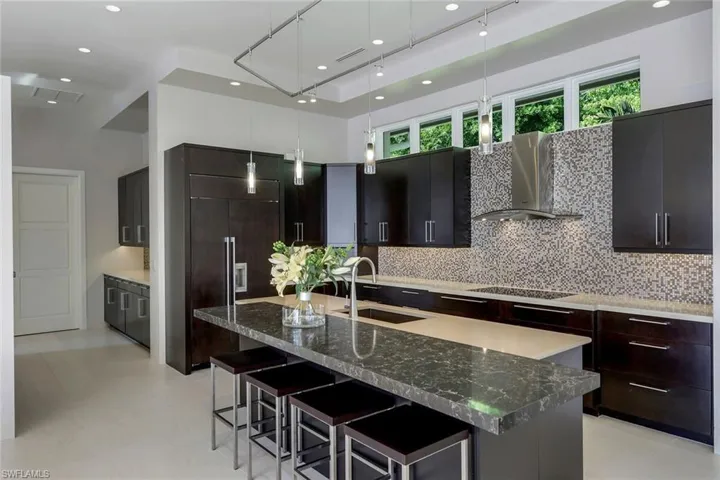 Kitchen with subzero refrigerator and view into the butler's pantry.