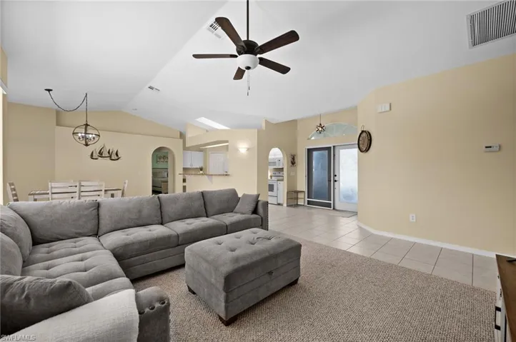 Living Room looking toward Foyer and Front Double Doors with Transom Window