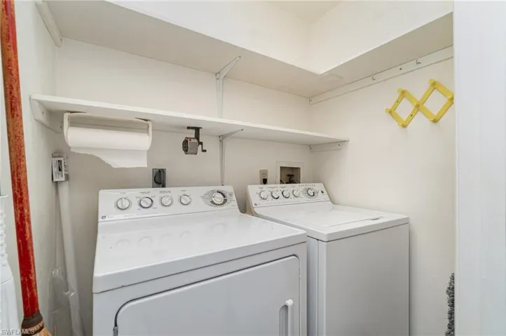 Washroom featuring independent washer and dryer