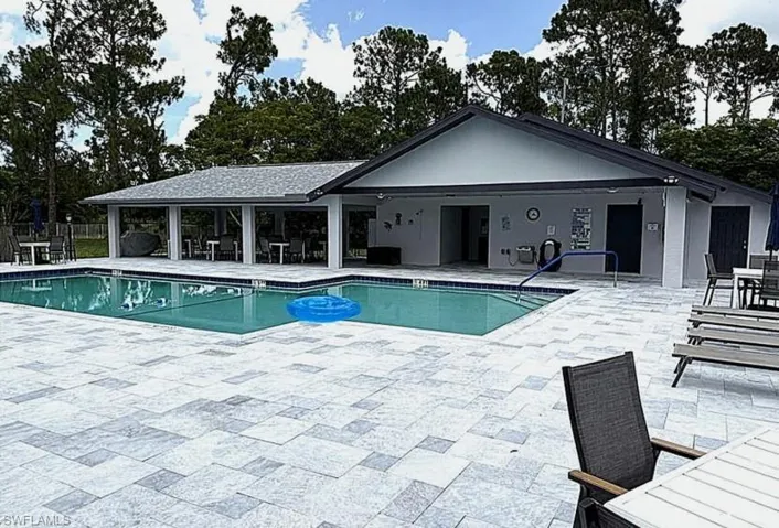 Community pool featuring a patio area