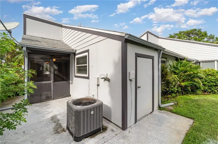View of outdoor structure with a sunroom