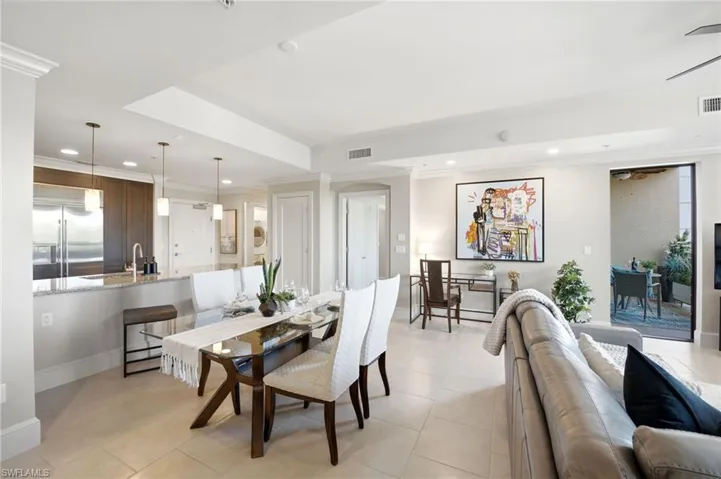 Elegant Open floor concept dinning area with light Tile