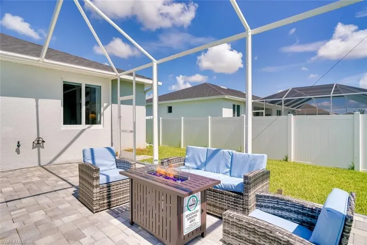 View of patio / terrace featuring glass enclosure and an outdoor living space