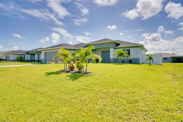 Ranch-style house featuring a front lawn
