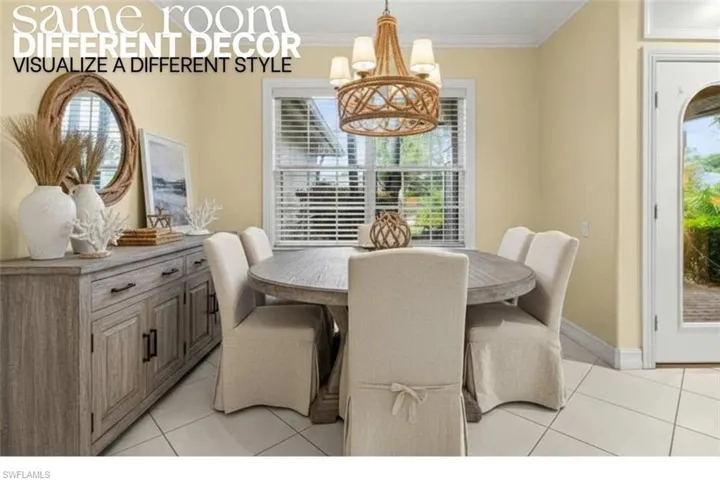 Dining room with light tile patterned floors, crown molding, and a chandelier