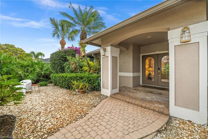 View of exterior entry with stucco siding