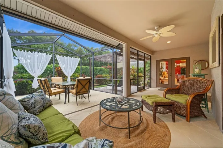 Sunroom with a patio area, a ceiling fan, outdoor lounge area, and outdoor dining space
