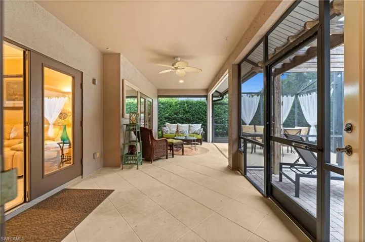 Sunroom featuring ceiling fan and outdoor lounge area