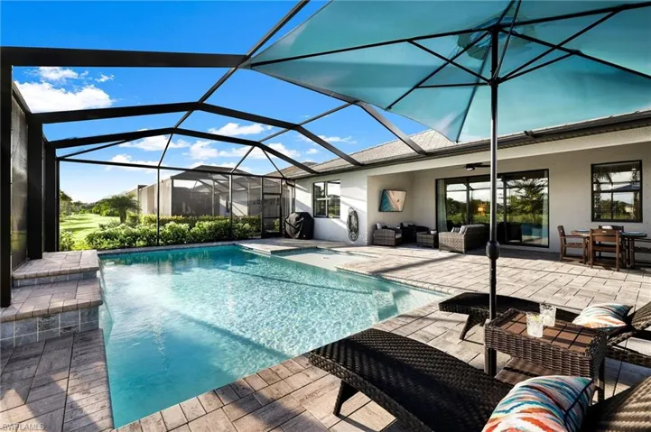 Beautiful custom heated pool with sunshelf and waterfall feature.