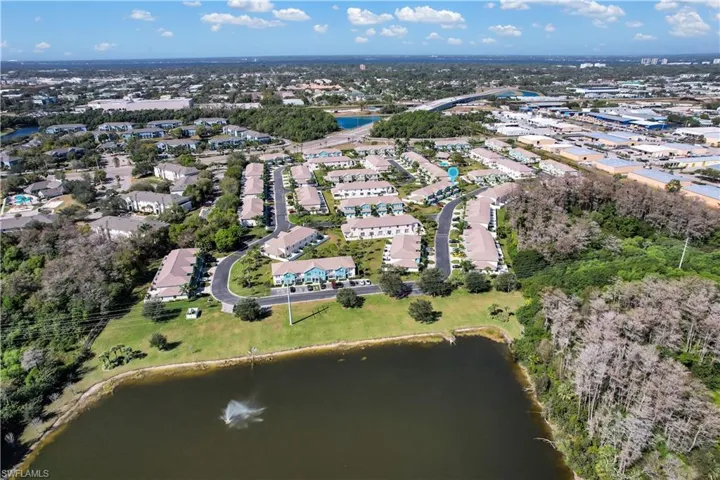 Large Lake w/ Picnic Areas In Rear Of Community