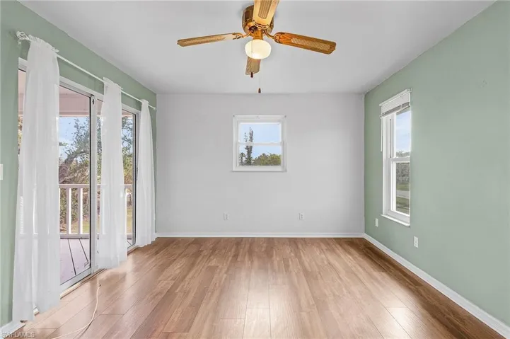 Master Bedroom has sliders out to screen porch.