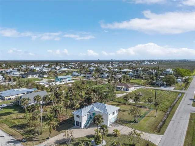 Home has a semi-circle driveway with two entrances and plenty of parking.