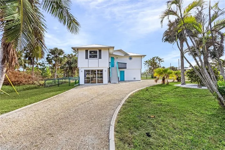 View of Home from Rose Ave with extended driveway.