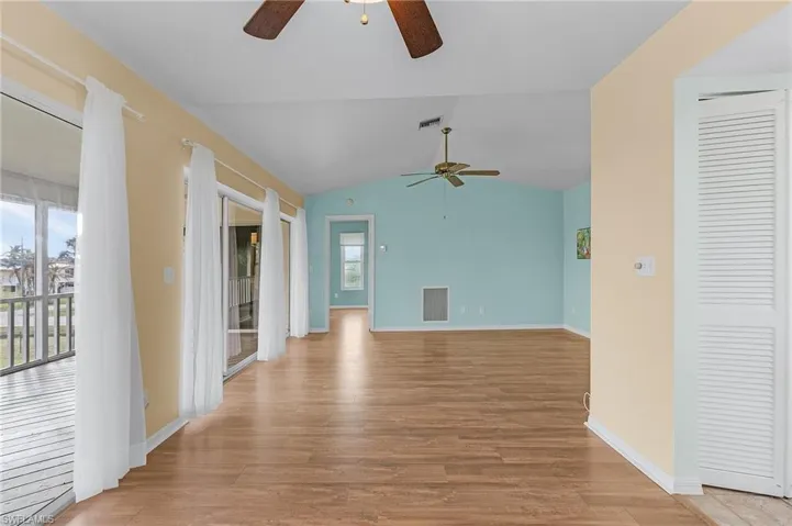 Dining Room and Living Room with master bedroom in the background.