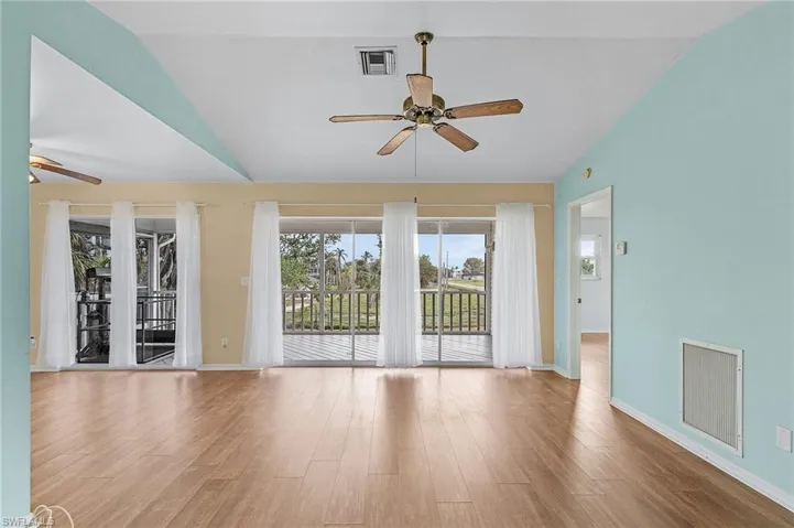 Living Room and Dining Room sliders leading to screen porch.