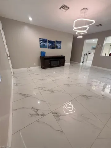 Entry/ Great room with large tile and natural light