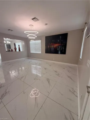 Entry/ Great room with large tile and natural light