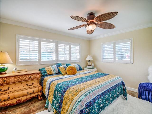 Bedroom #2 with custom bedspread and antique dresser