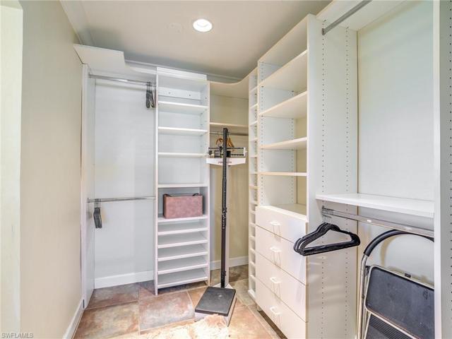 Walk-in closet in master bedroom.