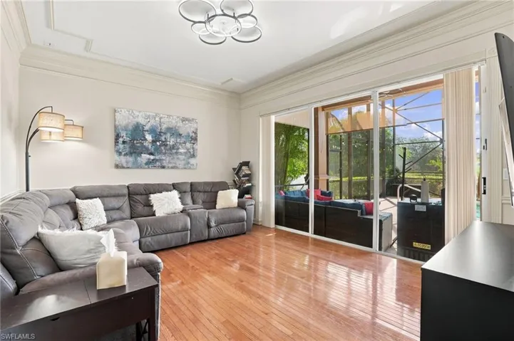 Family Room/Tv Room allows extra space in the home for family nights overlooking your pool and lanai area.