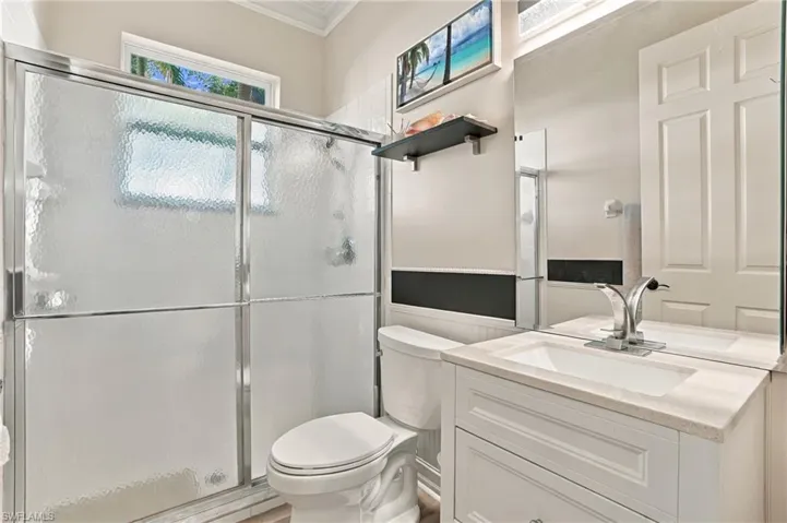 1st Floor Bathroom off Foyer and Den. Newer Vanity and Lighting.