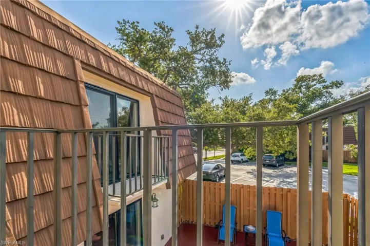 View of property exterior featuring a balcony
