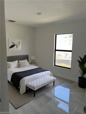 Bedroom featuring baseboards