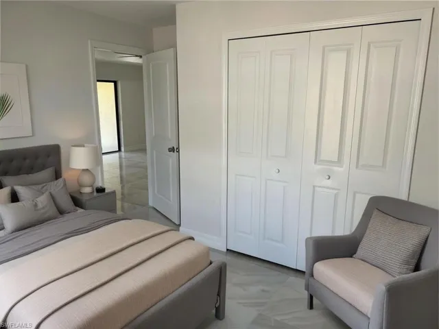 Bedroom featuring a closet and baseboards