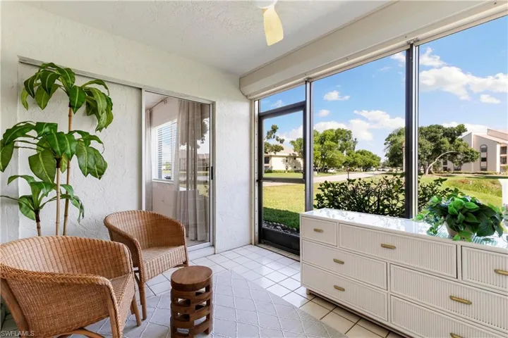 Sunroom featuring ceiling fan