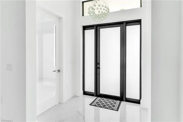 Entryway with a notable chandelier