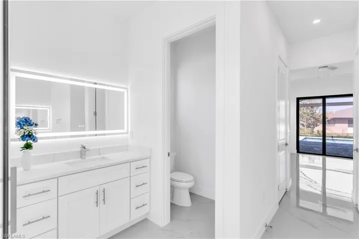 Bathroom with vanity and toilet
