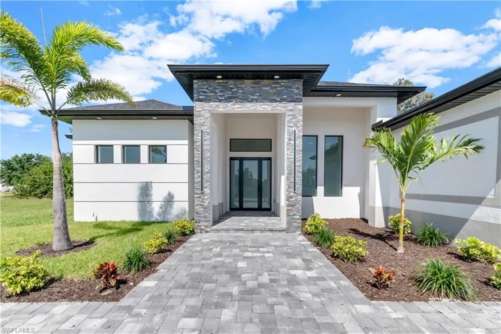 View of front of house with a front lawn