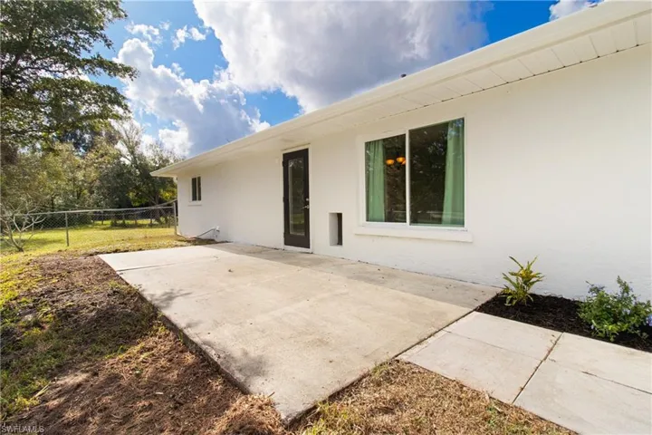 Back of property with a patio area