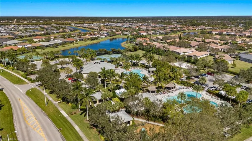 View of property location with nearby suburban area and a nearby body of water