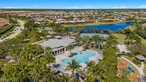 Aerial overview of property's location with a nearby body of water and nearby suburban area